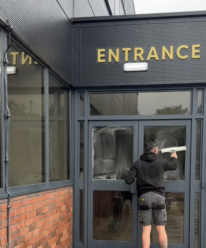 Entrance window cleaning at Trade Mastermind HQ