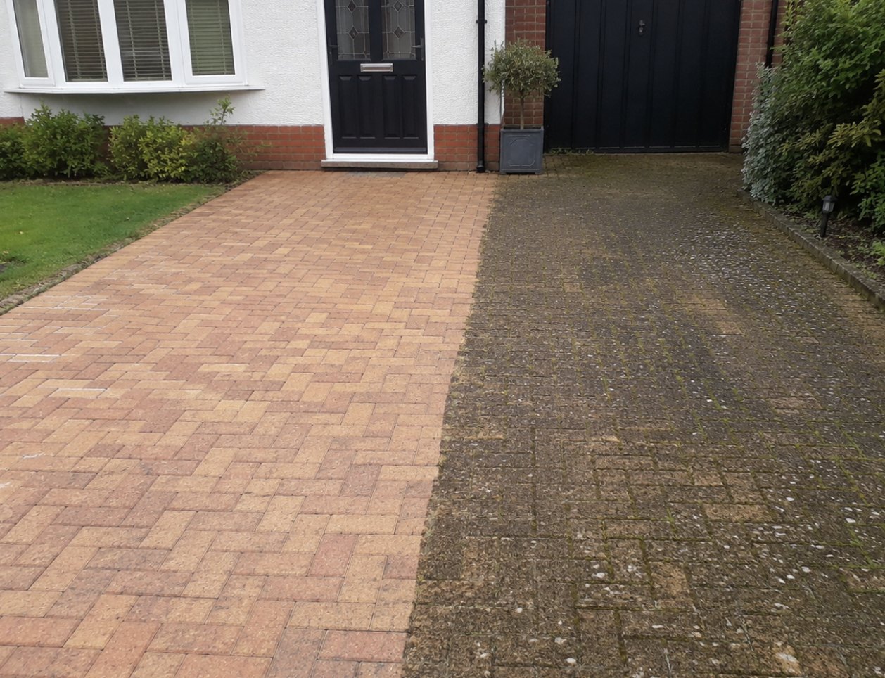 Block paving driveway half cleaned showing the difference