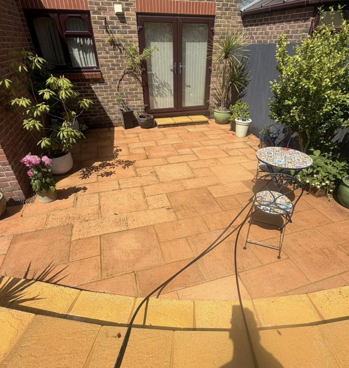 Courtyard patio cleaned to a warm sandstone finish