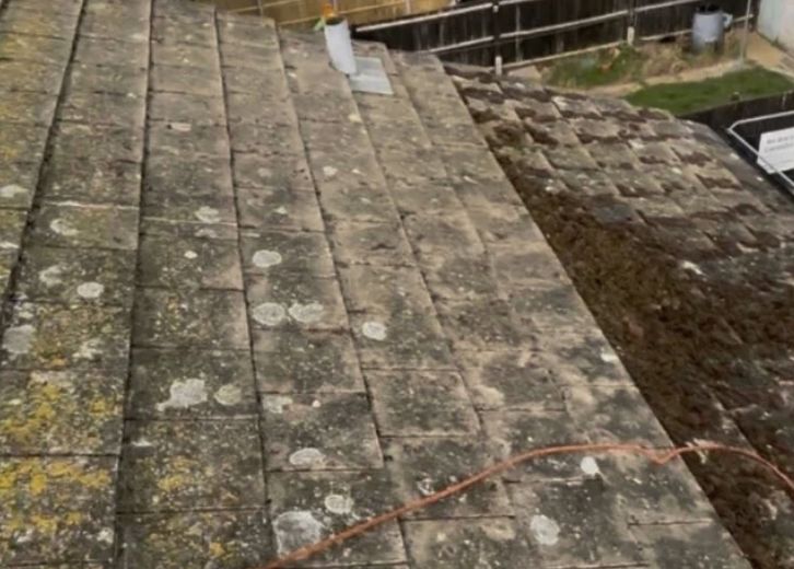 Cleaning a grey tiled roof