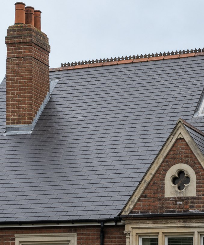 Slate roof cleaned to a dark finish by Arcline